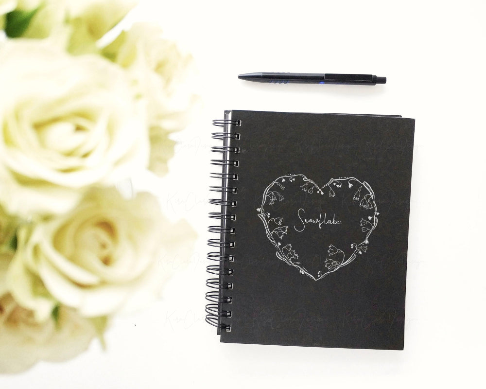 Hand-drawn Snowflake heart shape floral frame vector and clipart illustration in black and white for digital download.